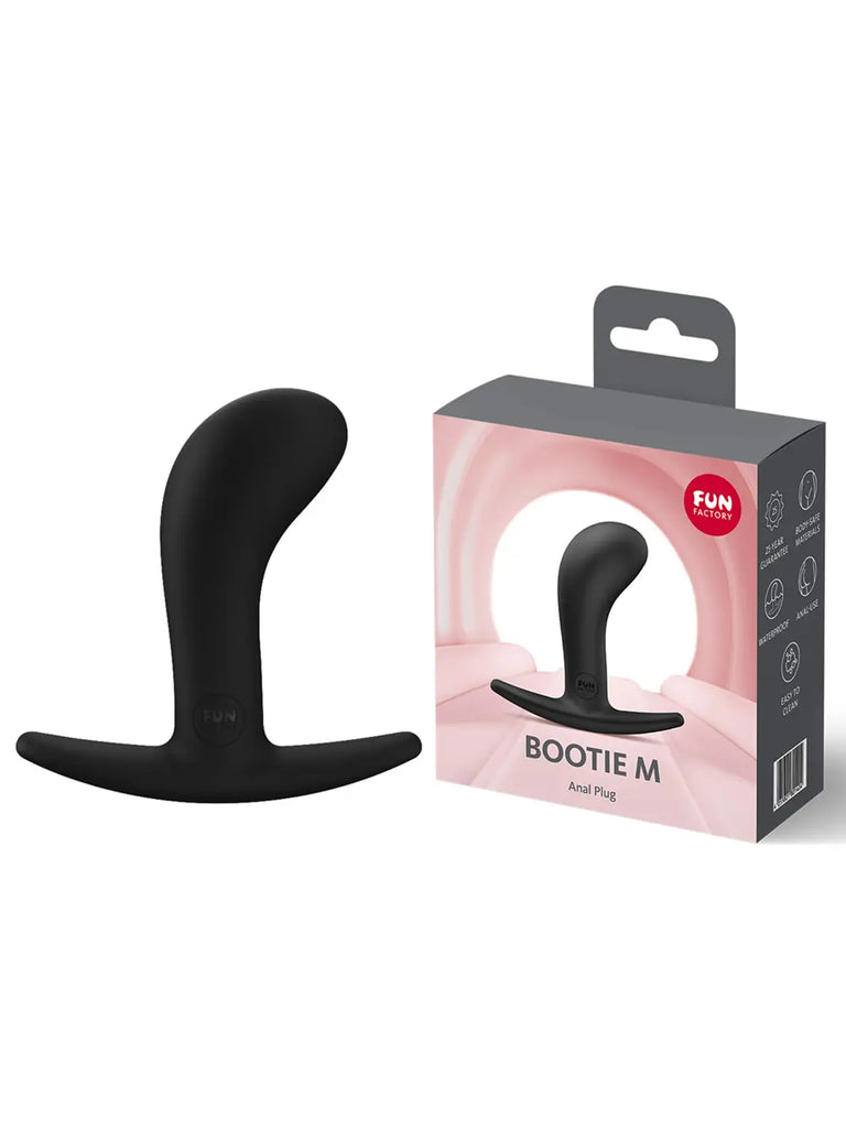 Black FUN FACTORY Bootie Medium displayed beside its original branded retail packaging