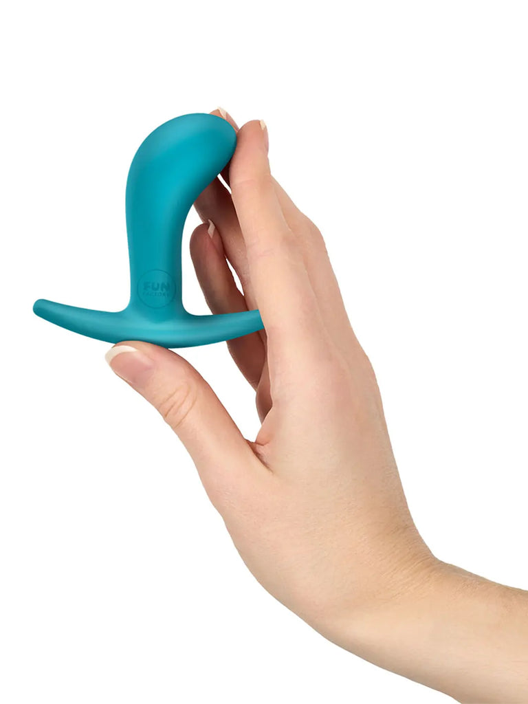 Aquamarine FUN FACTORY Bootie Small shown in a hand to illustrate its discreet compact proportions