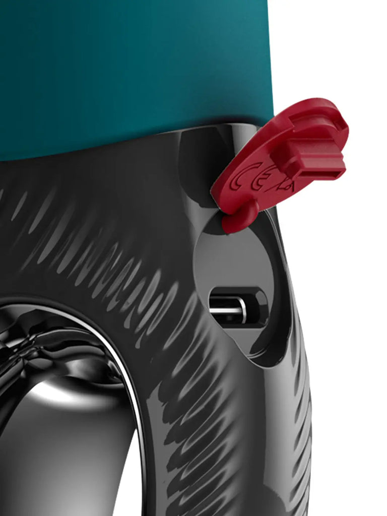 Close-up of FUN FACTORY Manta in bottle green showing textured silicone detail and charging port.