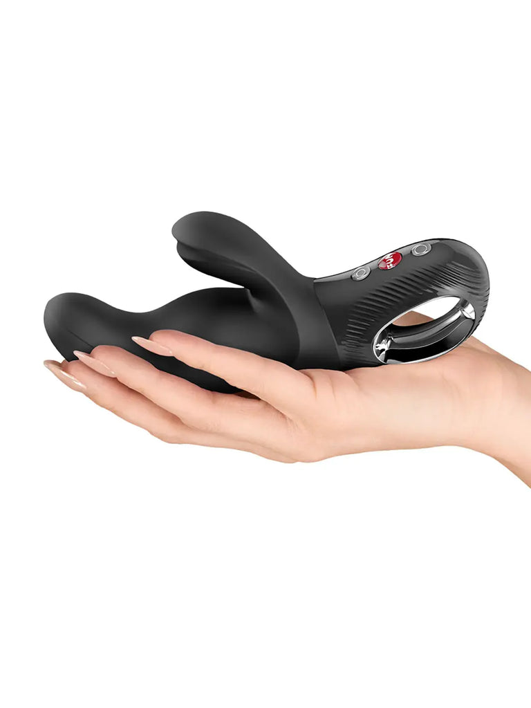 Black FUN FACTORY Miss Bi displayed in a hand to show its shape and proportions