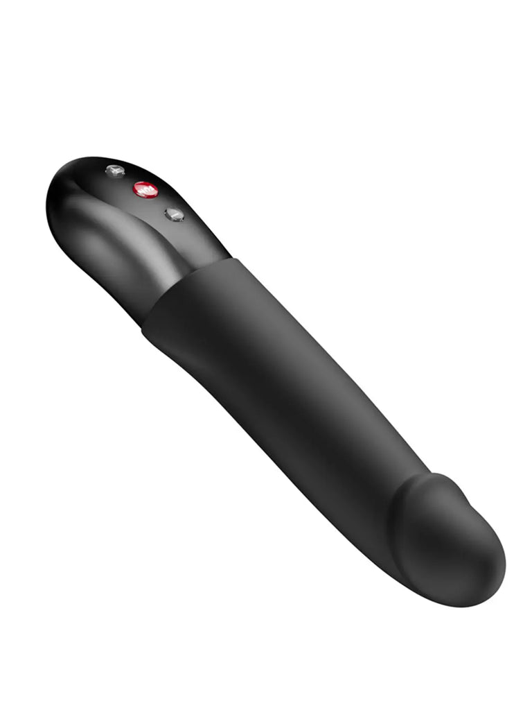 Black FUN FACTORY Stronic Real positioned horizontally to show its curved profile and control buttons